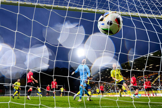 Jacob Ondrejka of Sweden (not pictured) scores 1-1 behind