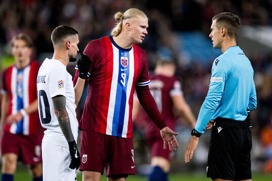 Erling Braut Haaland of Norway argues with the referee