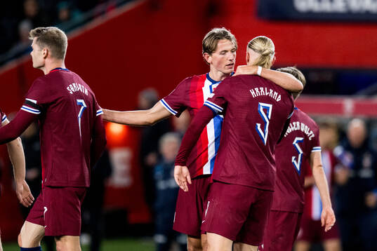 Erling Braut Haaland of Norway celebrates with Sander Berge