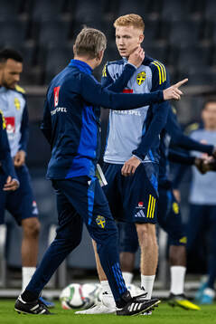 head coach Jon Dahl Tomasson and Hugo Larsson of the