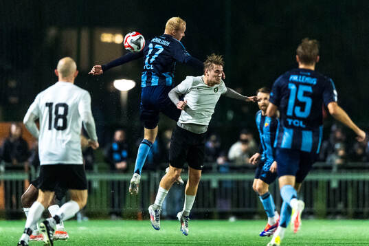 Djurgårdens Peter Therkildsen och FC Järfällas Adam Wurtz