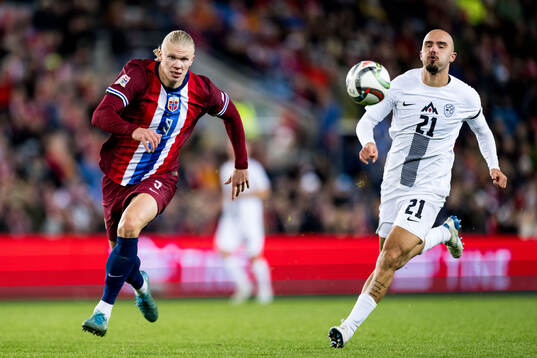 Erling Braut Haaland of Norway and Vanja Drkusic of Slovenia