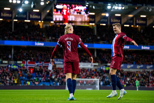 Erling Braut Haaland of Norway celebrates with teammate