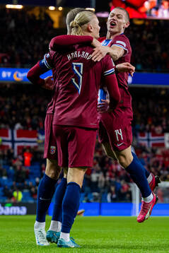 Erling Braut Haaland of Norway celebrates with teammate