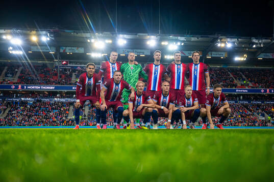 The starting eleven of Norway pose for a team photo