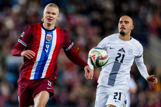 Erling Braut Haaland of Norway and Vanja Drkusic of Slovenia