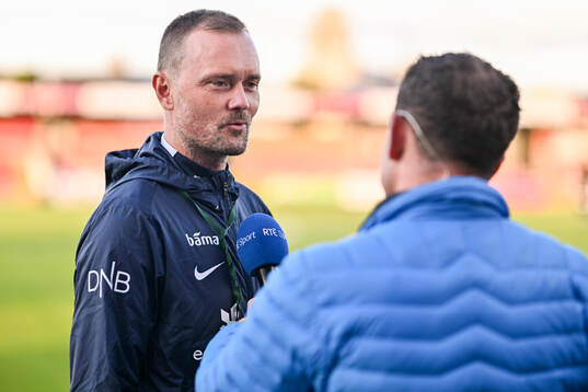 head coach Jan Peder Jalland speaks to media