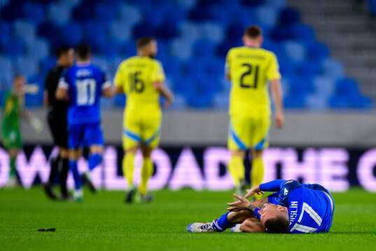 Lukás Haraslin of Slovakia in pain