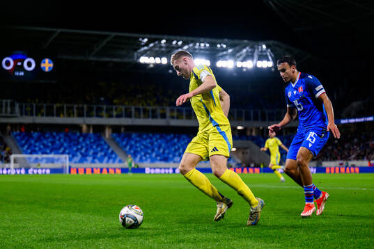 Dejan Kulusevski of Sweden and David Strelec of Slovakia