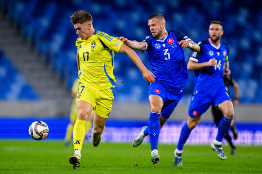 Viktor Gyökeres of Sweden and Denis Vavro of Slovakia