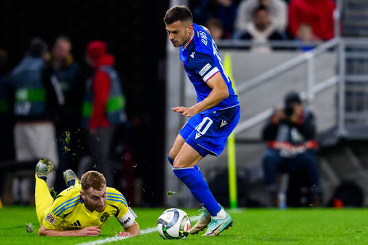 Dejan Kulusevski of Sweden and Lászlo Bénes of Slovakia