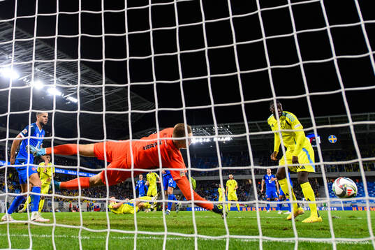 Ken Sema of Sweden scores 0-2 om goalkeeper Marek Rodák of