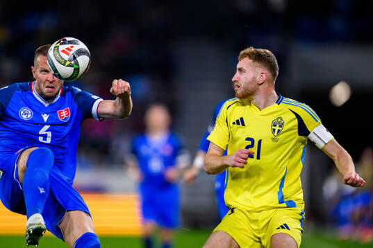 Denis Vavro of Slovakia and Dejan Kulusevski of Sweden