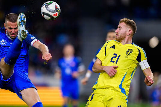 Denis Vavro of Slovakia and Dejan Kulusevski of Sweden