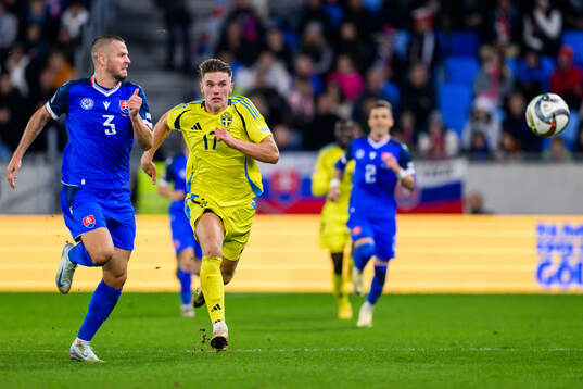 Denis Vavro of Slovakia and Viktor Gyökeres of Sweden