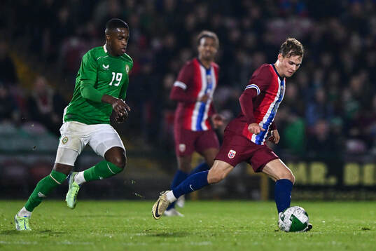 Aidomo Emakhu of Republic of Ireland and Kristian Arnstad