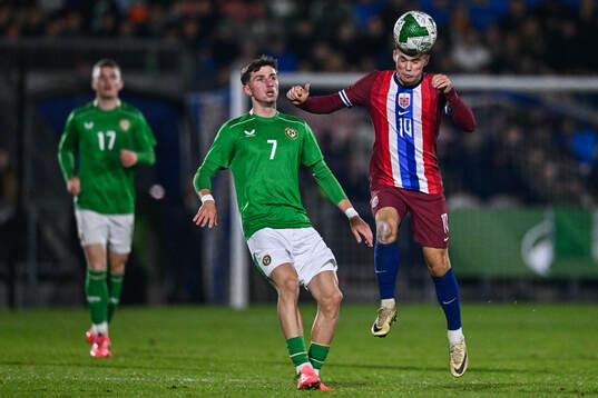 Rocco Vata of Republic of Ireland and Kristian Arnstad of