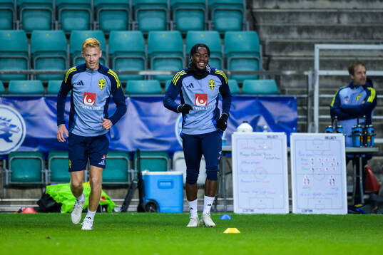 Hugo Larsson and Anthony Elanga of the Swedish men's