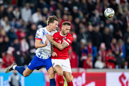 Sander Berge of Norway and Marko Arnautovic of Austria