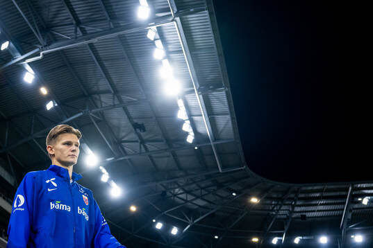 David Møller Wolfe of Norway enters the pitch