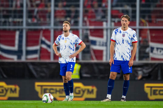 Kristoffer Ajer and Sander Berge of Norway look dejected