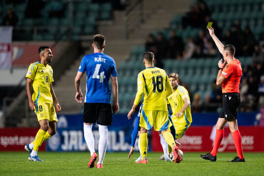 Alex Douglas of Sweden receives a yellow card from referee