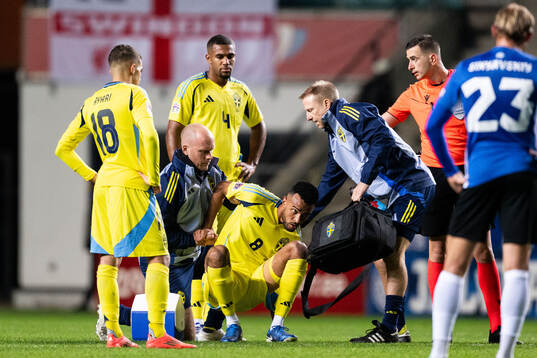 Alex Douglas of Sweden receives medical attention
