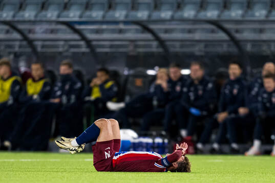 Mathias Fjørtoft Løvik of Norway in pain