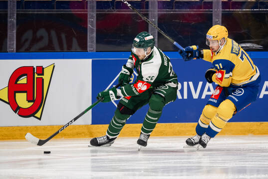 Marcus Westfält of Färjestad  and Stefan Espeland of