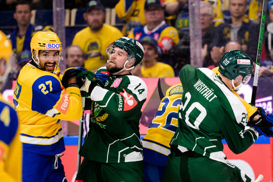 Andreas Martinsen of Storhamar and Henrik Björklund of