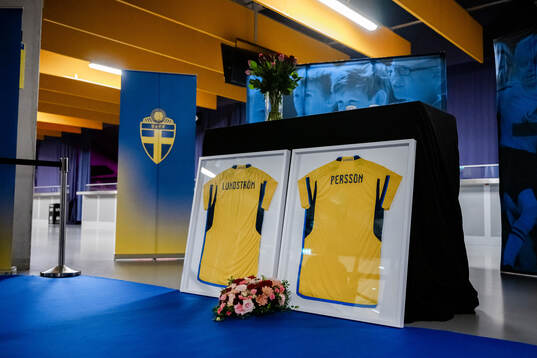 Jerseys with the names of the two victims of the terror