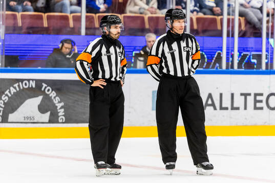 Domare Tobias Björk och Domare Mattias Enroth