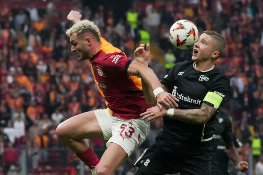 Baris Alper Yilmaz of Galatasaray and Sebastian Holmen of