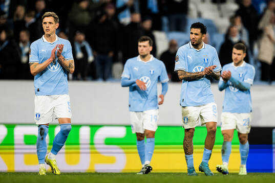 Søren Rieks and Sergio Pena of Malmö FF look dejected