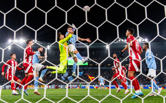 Colin Rösler of Malmö FF in action with goalkeeper Kostas