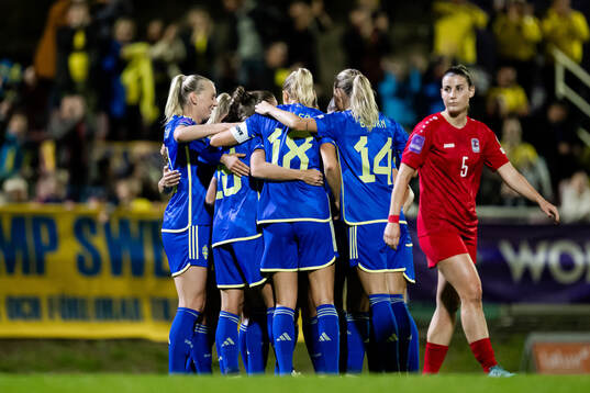 Players of Sweden celebrate with Filippa Angeldahl of Sweden