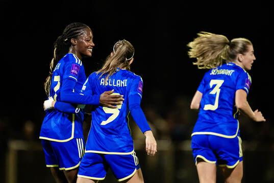Evelyn Ijeh and Kosovare Asllani of Sweden celebrate the