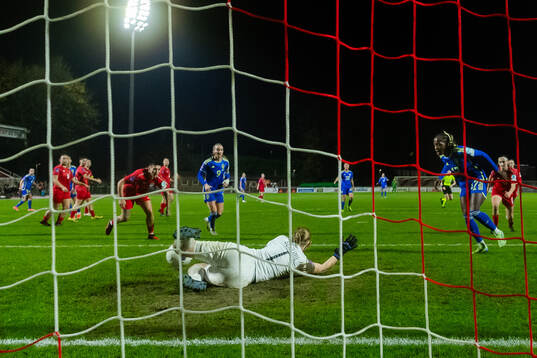 Evelyn Ijeh of Sweden scores the 0-4 goal behind goalkeeper
