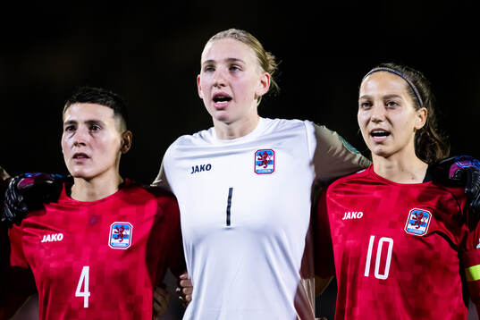 Andreia Machado, goalkeeper Lucie Schlime and Laura Miller