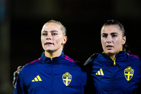 Fridolina Rolfö and goalkeeper Zecira Musovic of Sweden