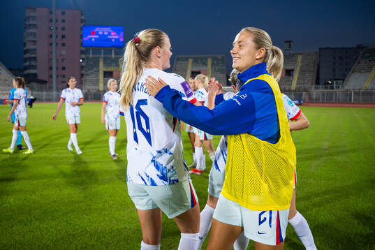 Mathilde Harviken and Lisa Naalsund of Norway celebrate