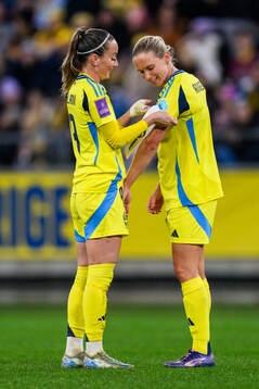 Kosovare Asllani and Jonna Andersson of Sweden
