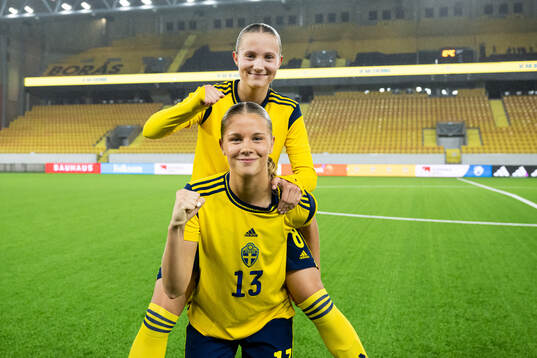 Fanny Peterson and Mollie Josefsson of Sweden celebrate