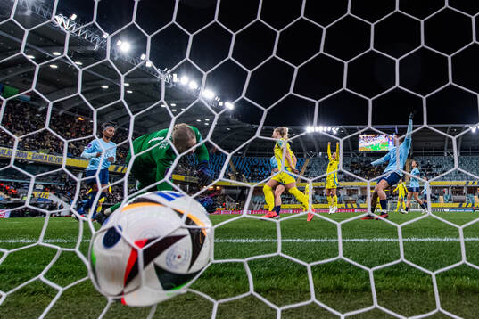 Rebecka Blomqvist of Sweden scores 8-0 behind goalkeeper