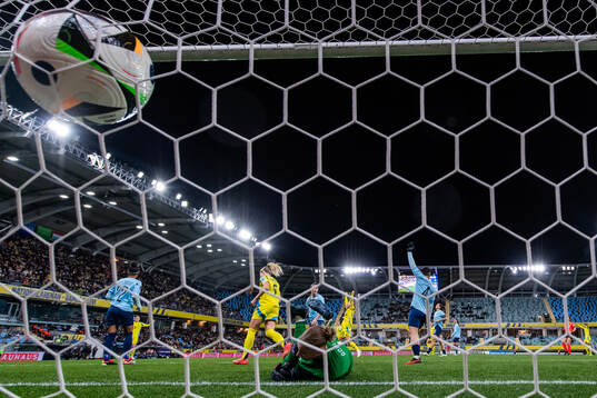 Rebecka Blomqvist of Sweden scores 8-0 behind goalkeeper