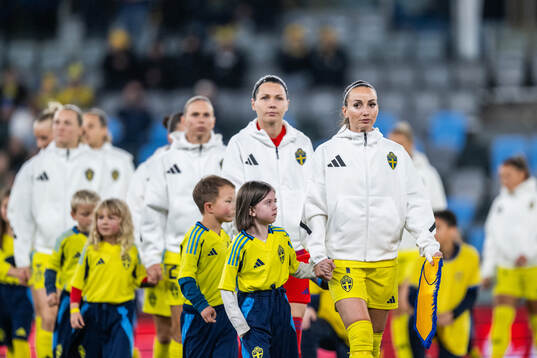 Goalkeeper Jennifer Falk and Kosovare Asllani of Sweden
