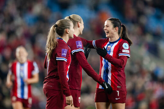 Frida Maanum and Tuva Hansen of Norway celebrate the 6-0