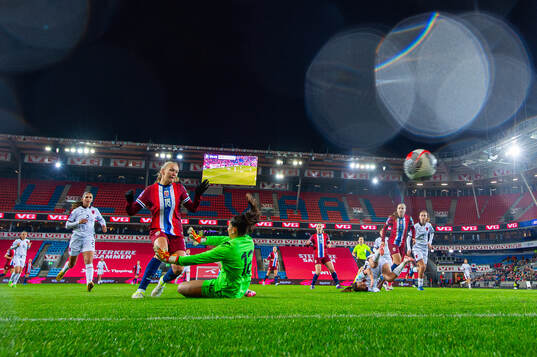 Frida Maanum of Norway scores the 4-0 goal past goalkeeper