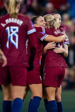 Lisa Naalsund of Norway celebrates with teammates Vilde