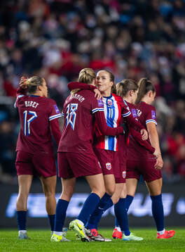 Frida Maanum of Norway celebrates with teammate Guro Reiten